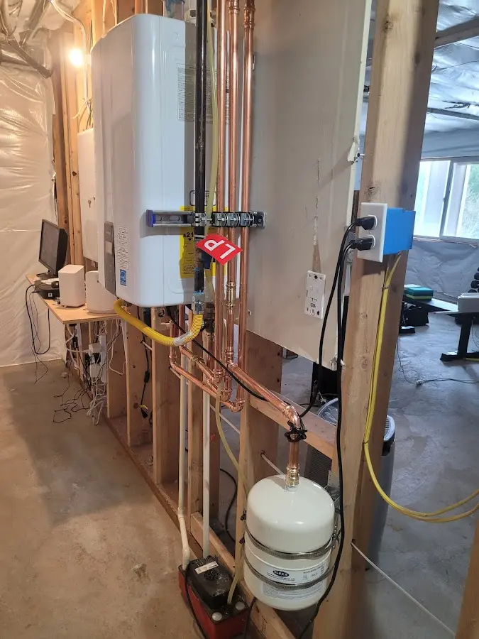 Licensed plumber repairing a kitchen sink in Norfolk